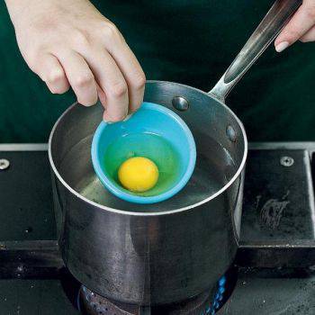 Gently crack an egg into a small bowl. When the water boils, lower bowl into the pot and let the egg slide, not drop, down.